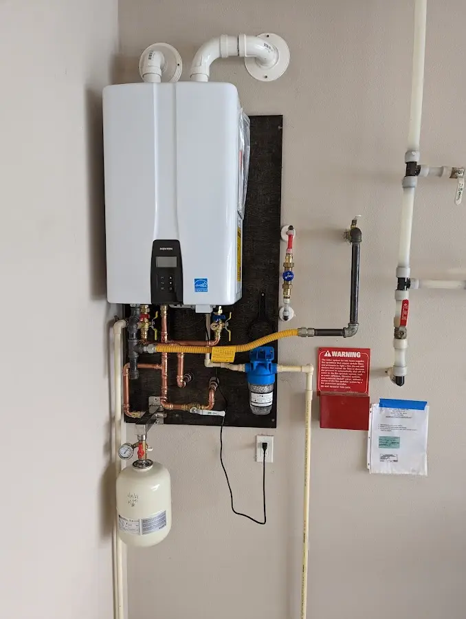 Professional plumber installing copper piping in a Alta Sierra home